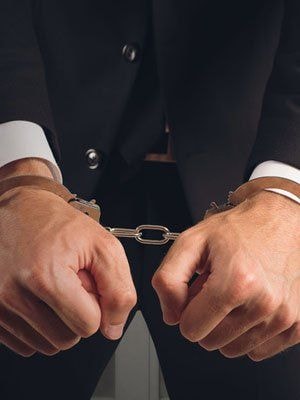 Man in handcuffs representing bail bondsmen services